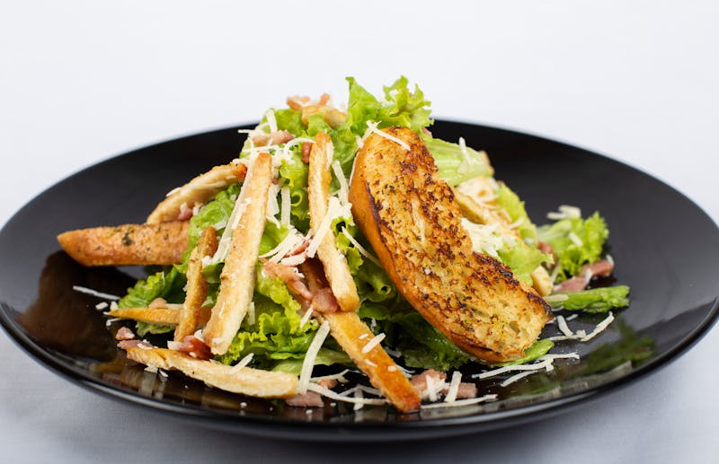 Caesar Salad fresh romaine with house-made dressing and croutons