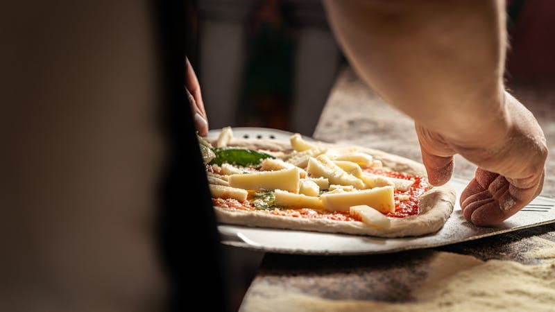 Punch Pizza chef crafting artisan pizza in Eden Prairie kitchen