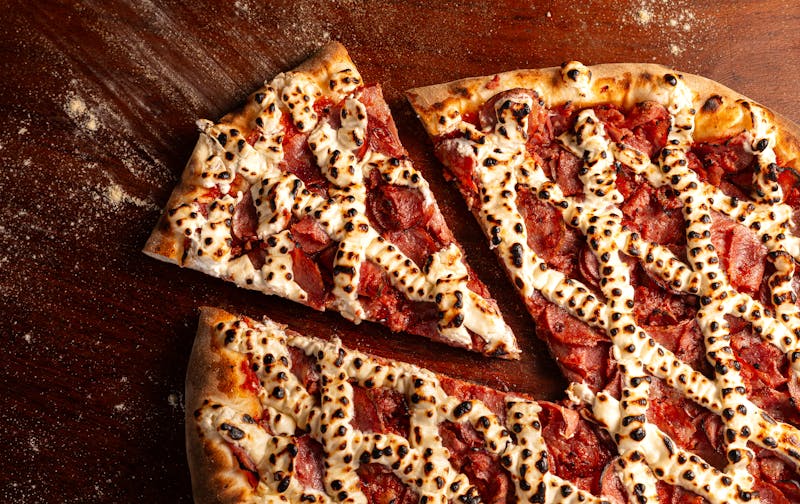 Spicy Arrabbiata veggie pizza with fire-roasted tomatoes and chili